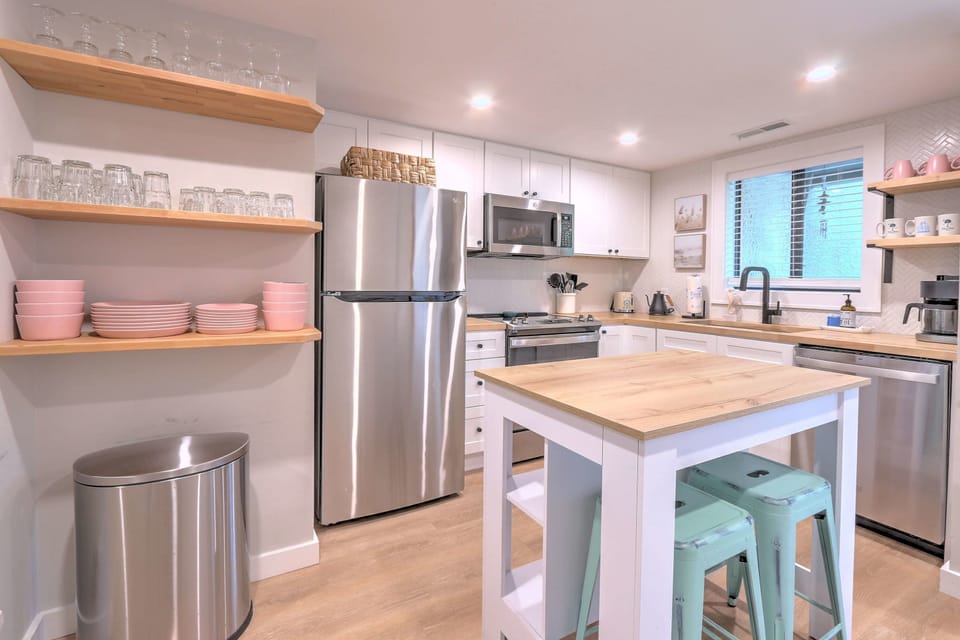 Featuring a center counter table with high seating for two