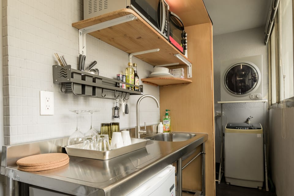 Kitchenette: 
• Microwave 
• Toaster Oven 
• Kettle 
• Fridge 
• Dinnerware 
