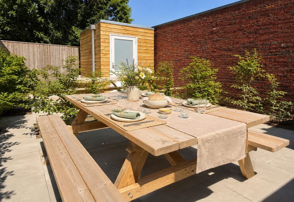 njoy your own private garden oasis, featuring a spacious outdoor dining area surrounded by greenery—perfect for relaxing mornings, al fresco meals, and peaceful evenings under the open sky.