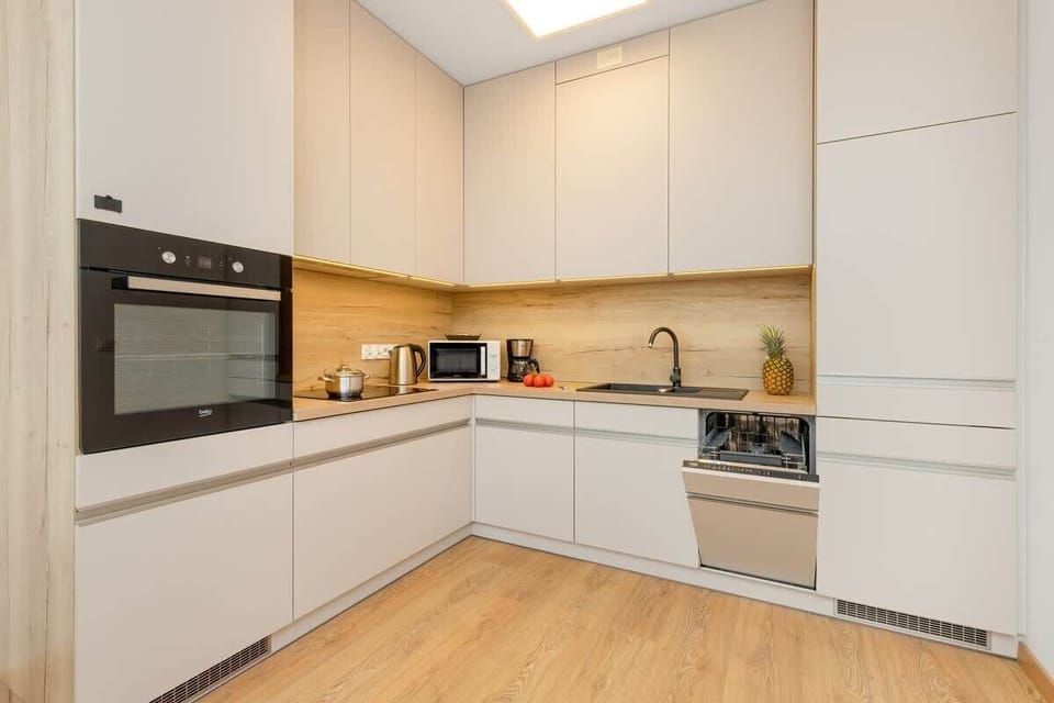 The fully equipped kitchenette includes everything you need for a home-cooked meal.