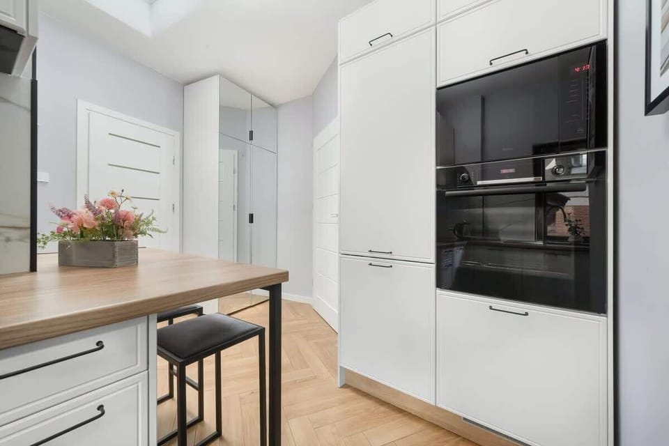 Kitchen with microwave and oven.