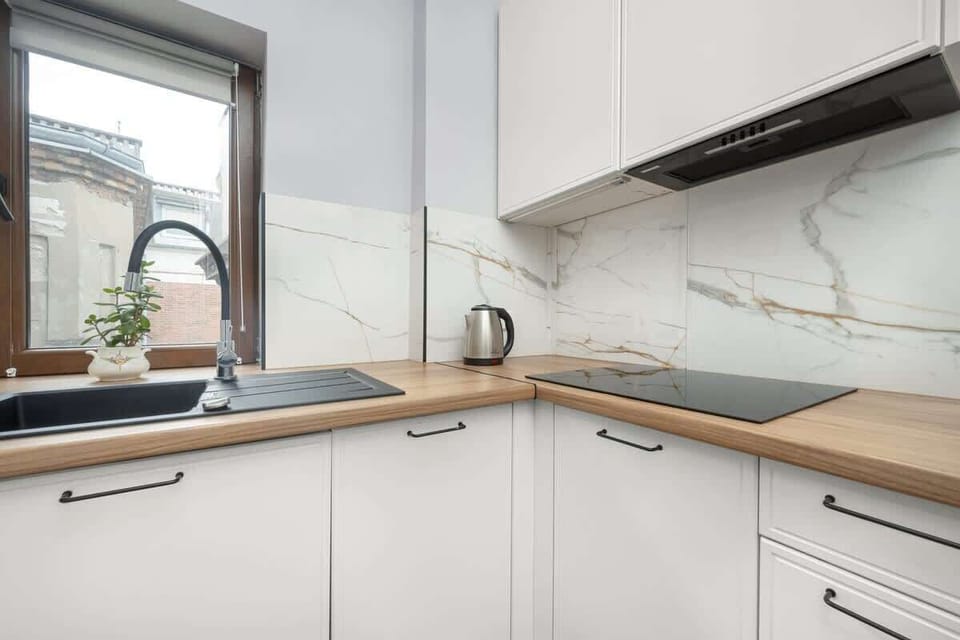 Separate kitchen with a kettle.