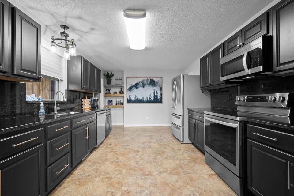 Full kitchen with stainless steel appliances