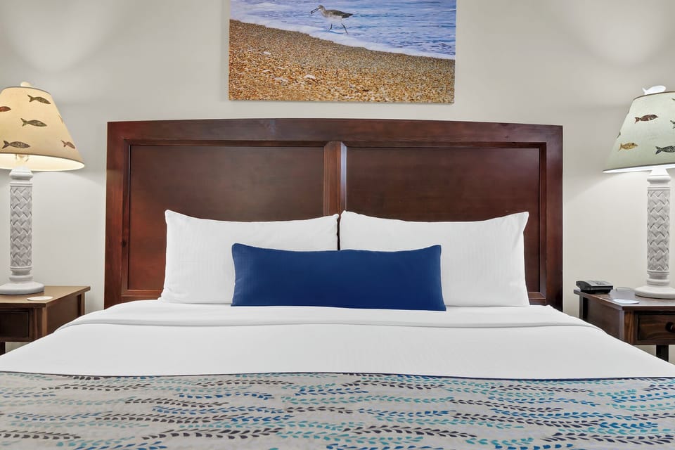 Drift off to restful sleep surrounded by coastal charm and crisp linens in your tranquil retreat.