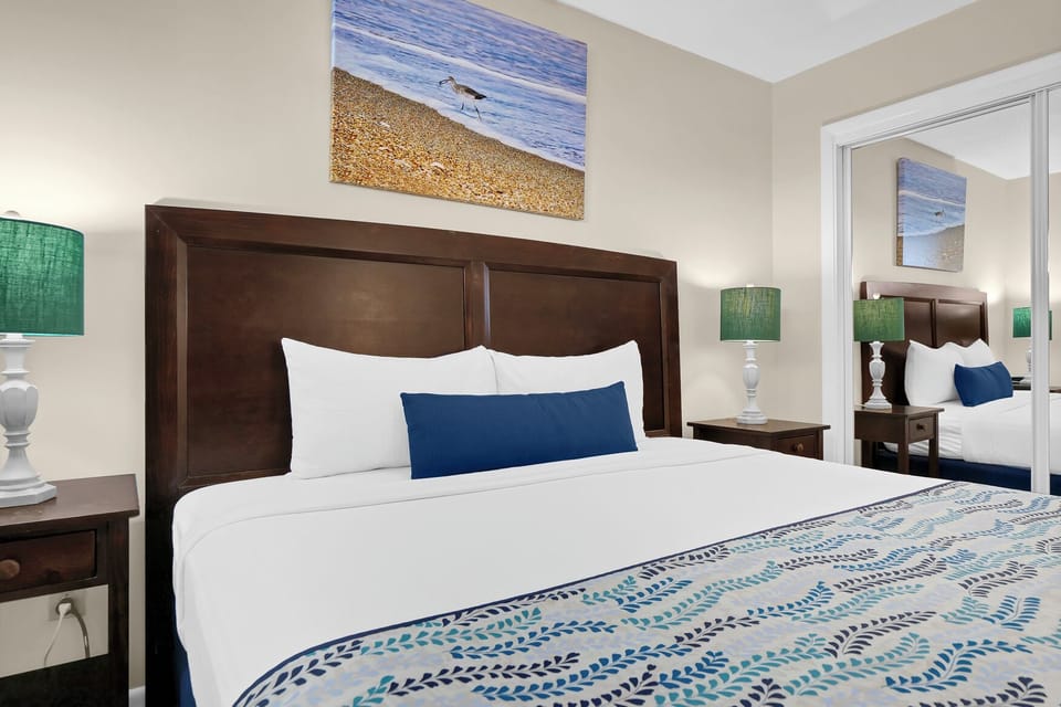 Drift off in your coastal-themed bedroom, where ocean artwork and nautical touches create a serene seaside retreat perfect for peaceful nights.