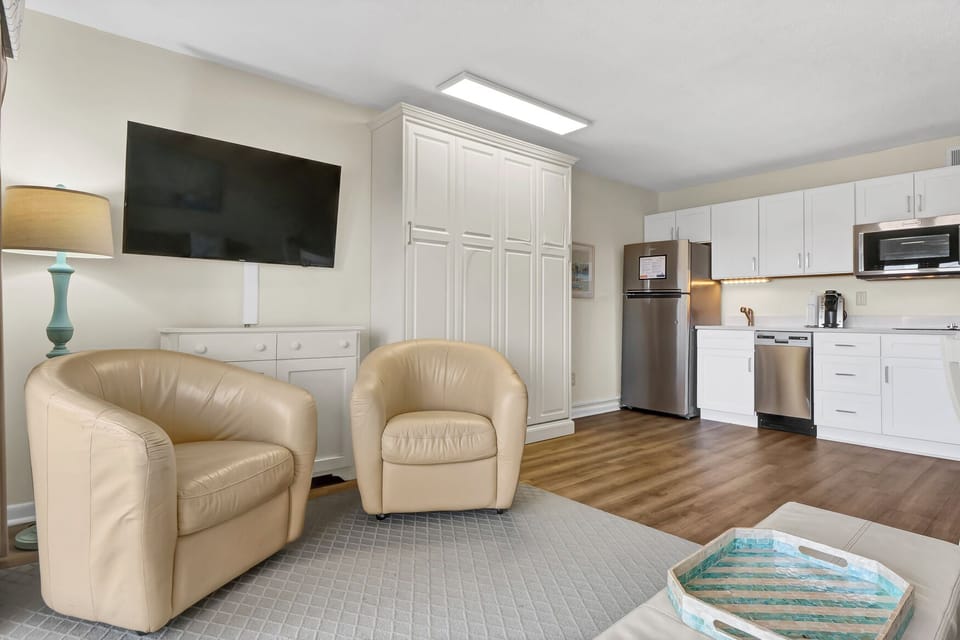 Relax in your spacious suite with plush leather seating, fully equipped kitchen, and modern amenities for the perfect home-away-from-home experience.
