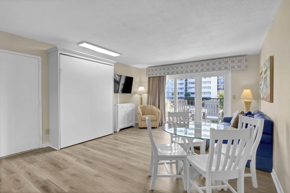 Relax in your spacious studio with a murphy bed, dining table for four, and private balcony where you can enjoy morning coffee or evening meals.