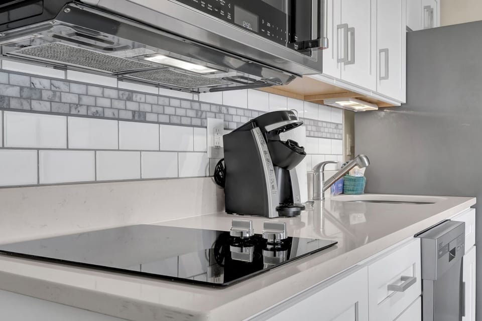 Your sleek kitchen features premium appliances and modern conveniences for effortless meal prep.