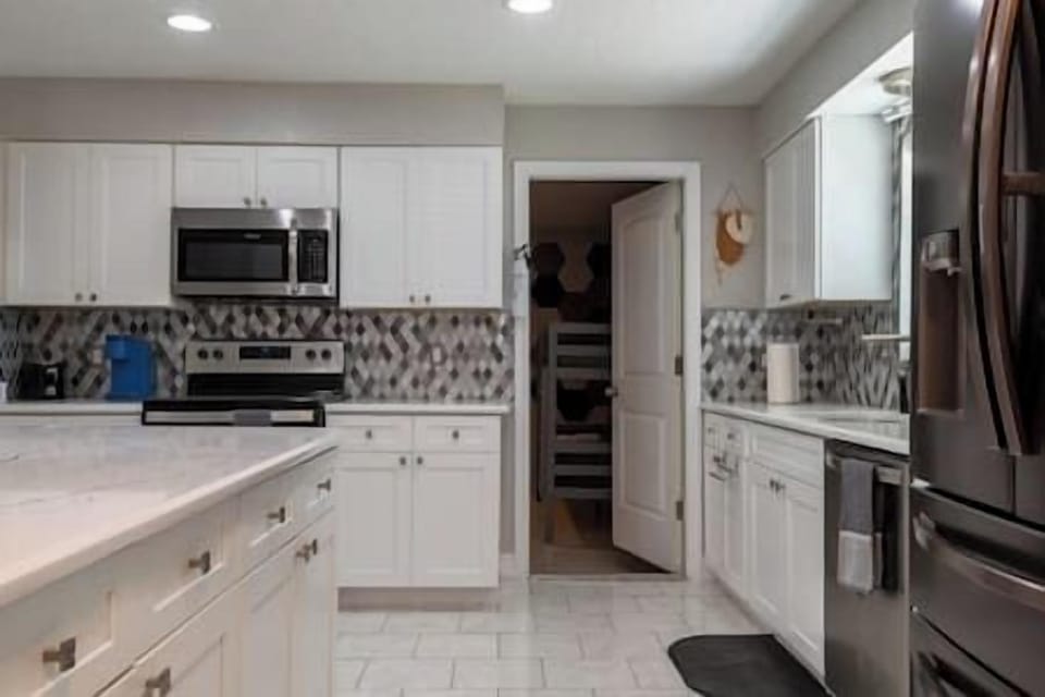 Fully equipped w/basic kitchenware, silverware, crockery, BBQ utensils, dishwasher, icemaker, & more
