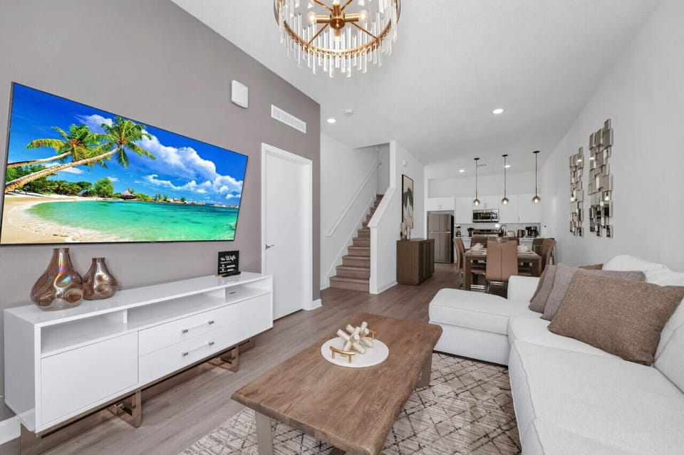 The living room was cozy and inviting, with a plush sofa nestled between a pair of elegant armchairs.