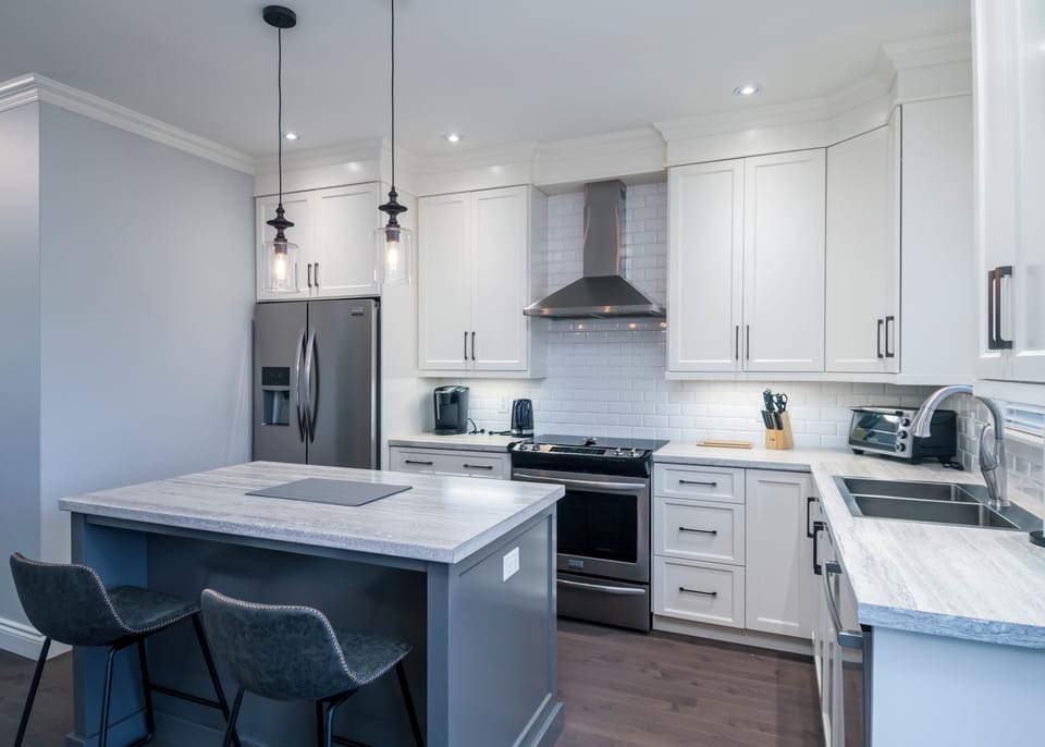 Fully equipped kitchen with stainless steel appliances, cookware, and everything you need to prepare meals at home.