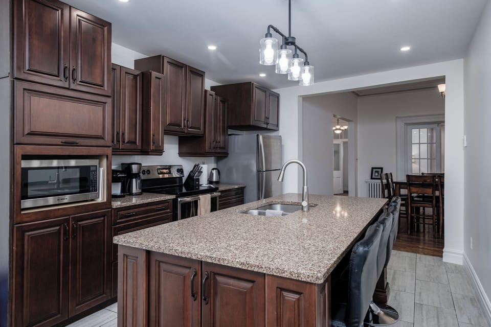 The kitchen seamlessly flows into the dining room, creating an open and inviting space for meals and gatherings.