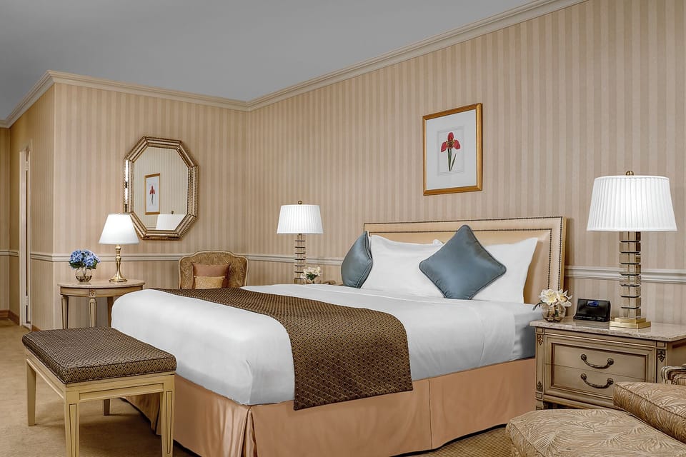 Sink into a spacious king bed with classic, elegant charm.