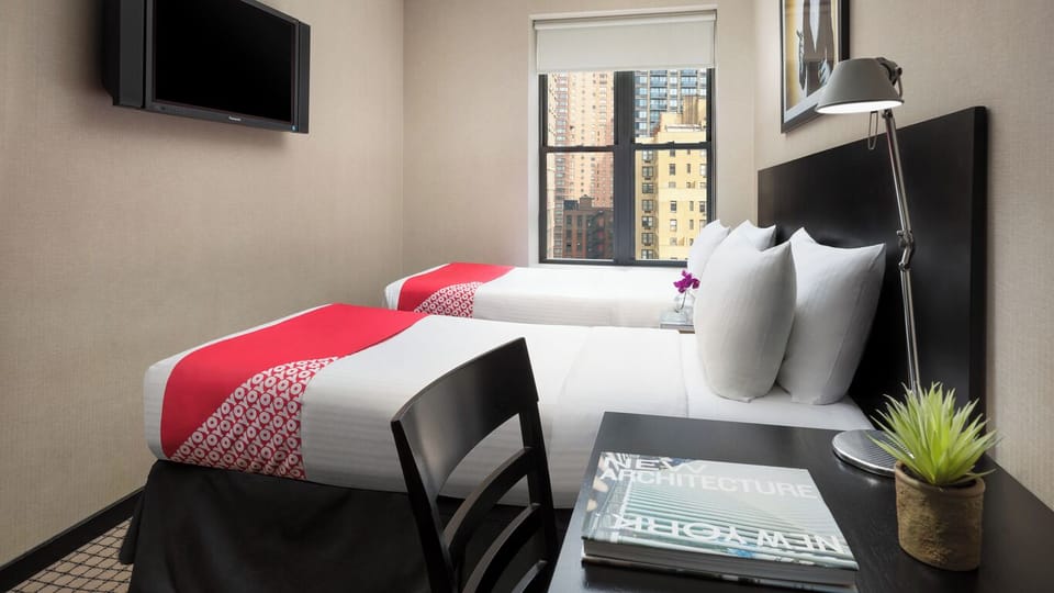 Bedroom with a comfortable 2 Double size beds. The exact unit will be assigned upon arrival. Views, colors, and decorations may vary.