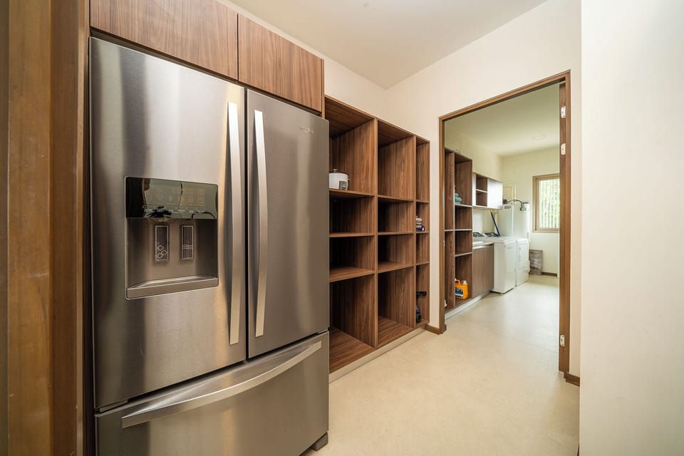 Pantry and laundry room with full size washer/dryer