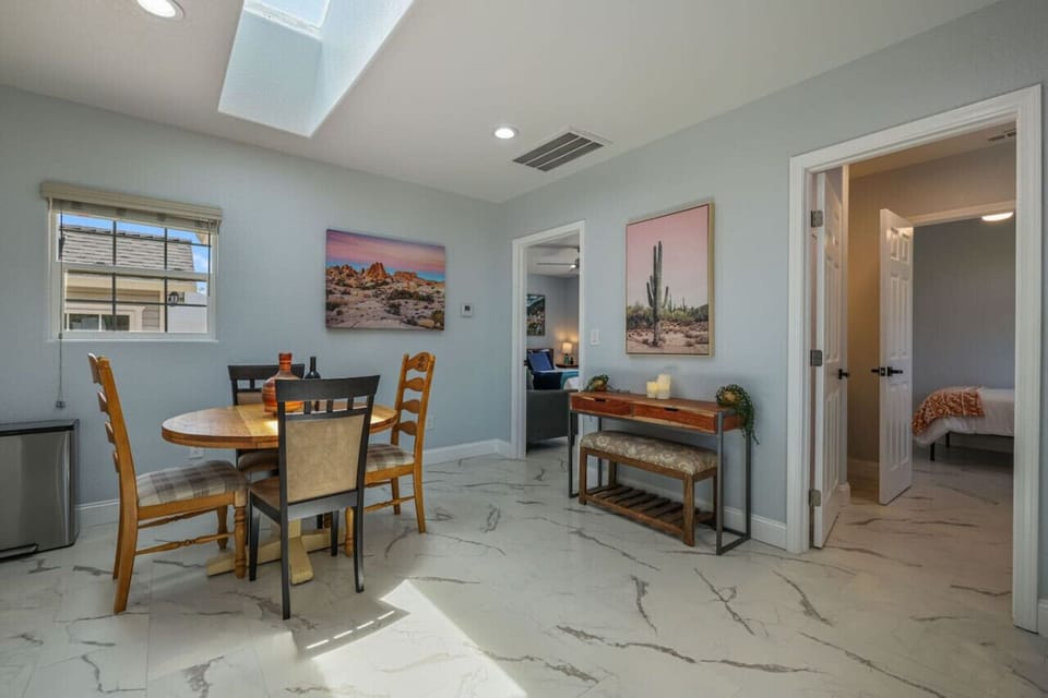 **Bright and Cozy Kitchen**  Enjoy your stay in our bright, fully-equipped kitchen with modern amenities. Perfect for preparing meals or enjoying a glass of wine at the charming dining table. Experience comfort and convenience in this welcoming space. Boo