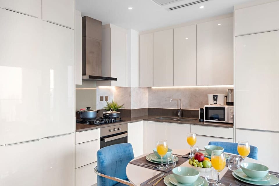 Modern Kitchen: Sleek cabinetry and a stylish dining nook for your culinary adventures!