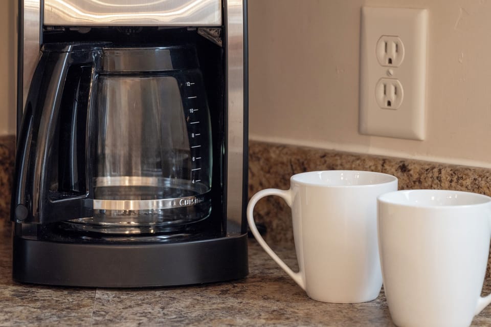 - Start your day with fresh coffee using the easy drip machine and ceramic mugs - Granite countertop offers space for breakfast setups or snack prep - Conveniently placed outlets make it easy to plug in and go each morning