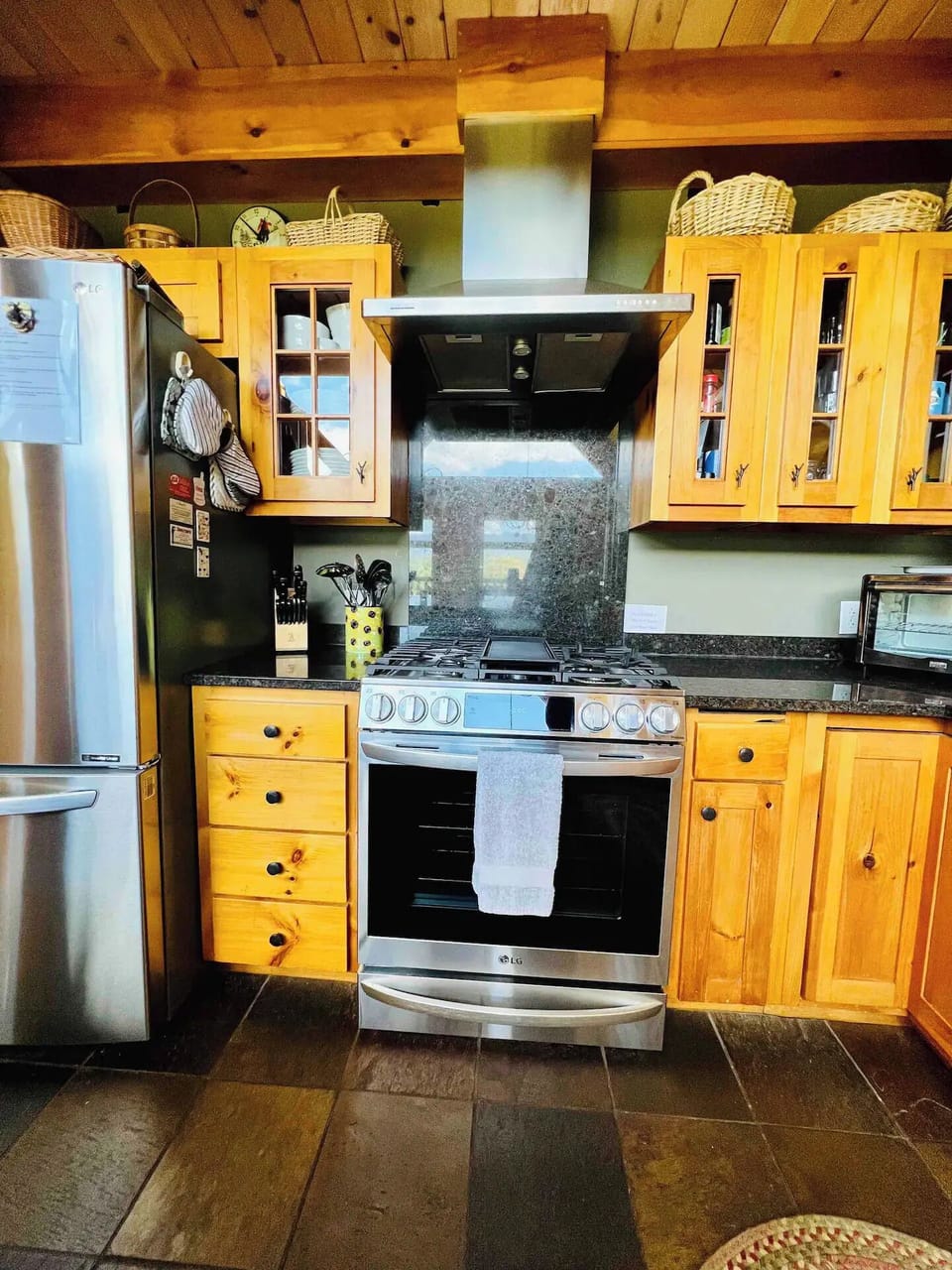 6 burner stove and cabinets full of kitchen essentials
