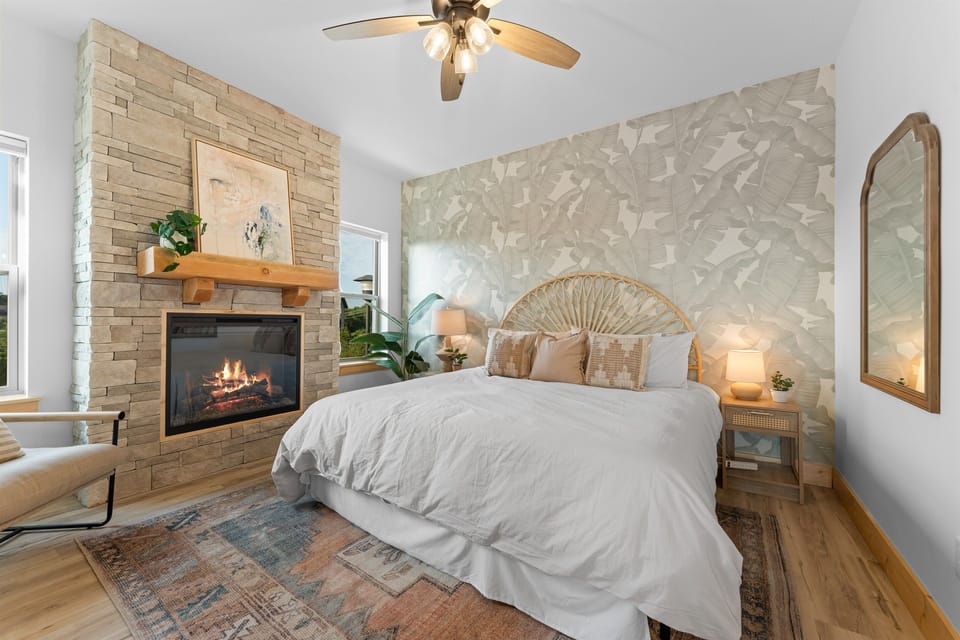 Another Master Bedroom with King-sized bed, its own fireplace & ensuite glass-enclosed shower for a luxurious rest