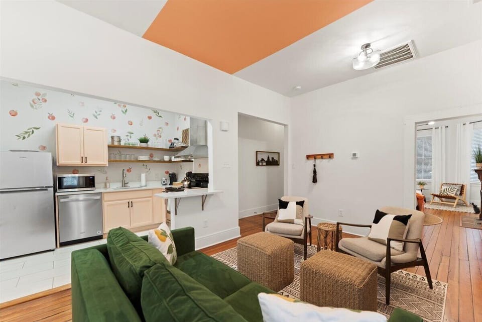 This open-concept living room and kitchen create the perfect space for gathering, dining, and making memories.