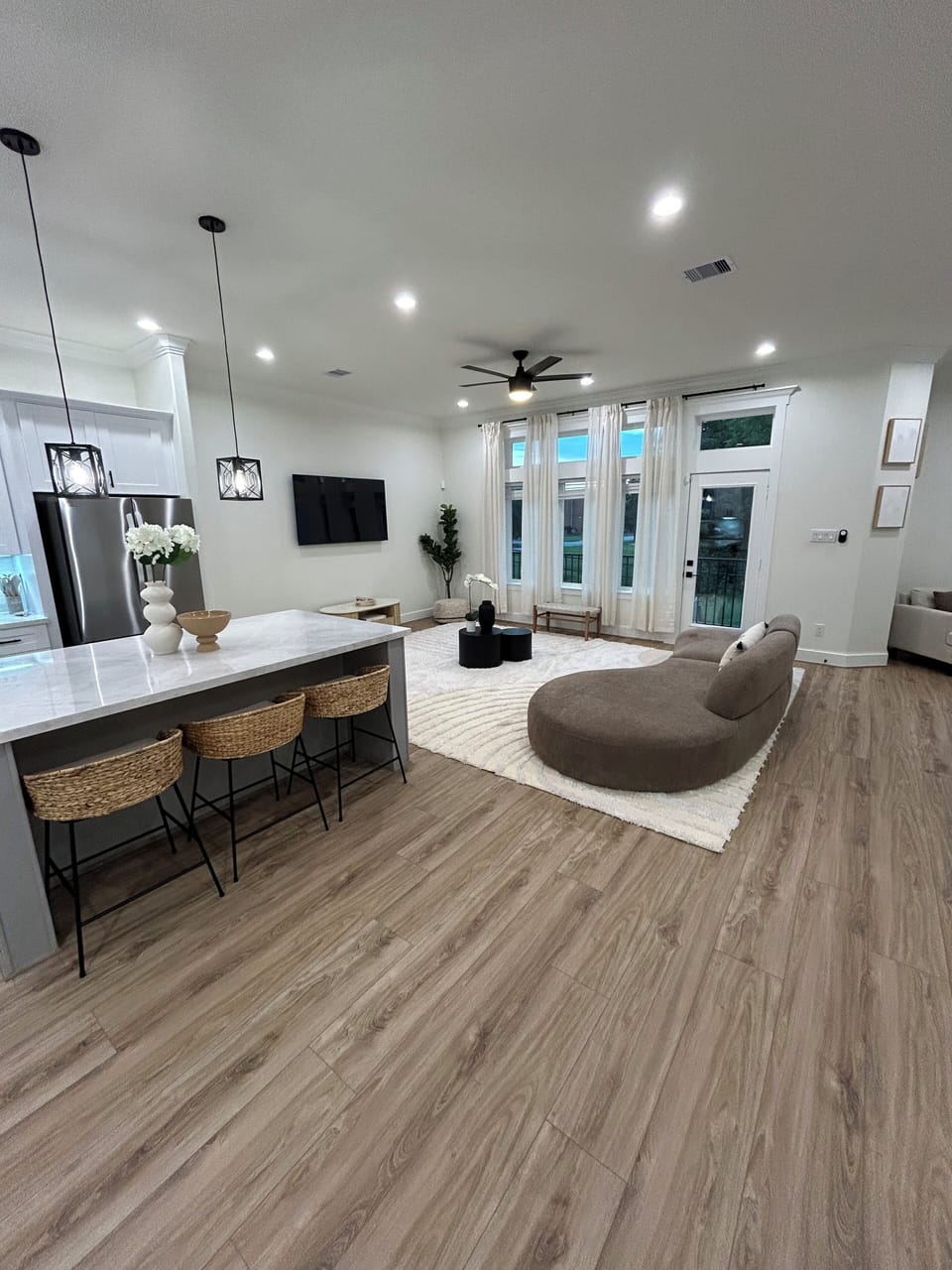 he living room is next to the spacious kitchen