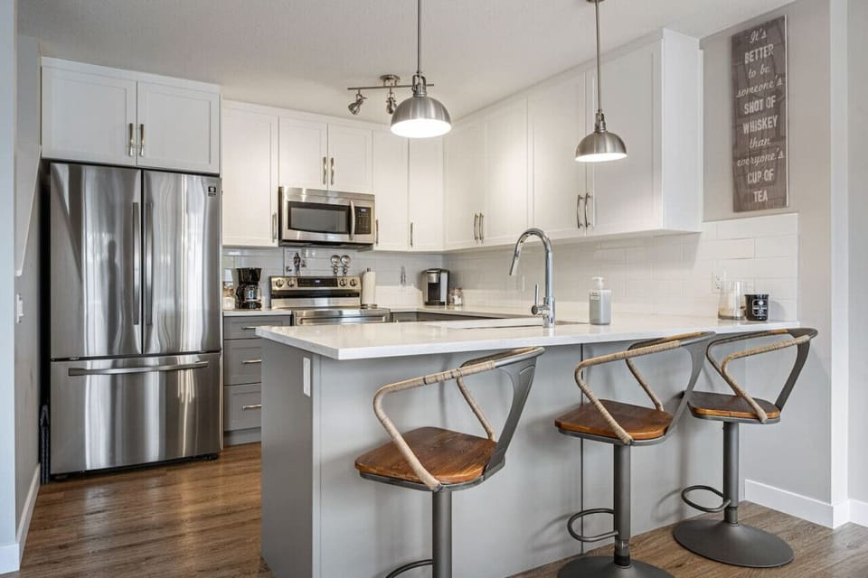 Full kitchen with island seating, Keurig & drip coffee maker, blender & more.