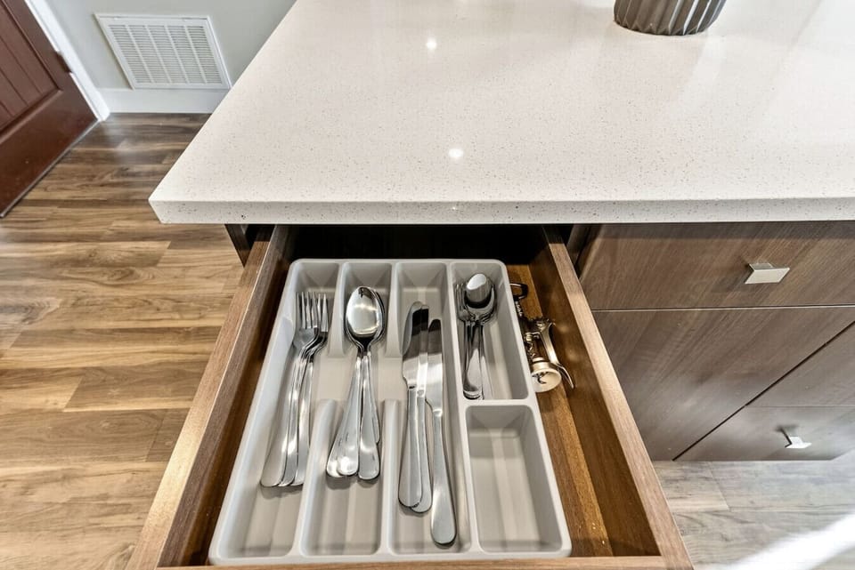 Organized kitchen drawer stocked w/ utensils, making meal prep a breeze