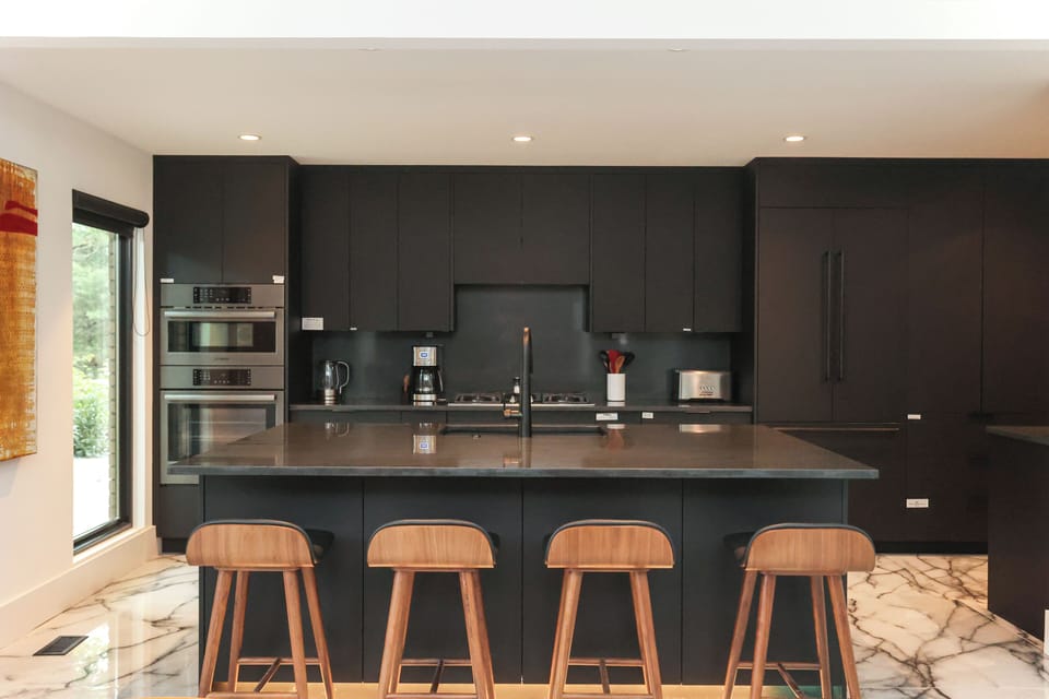 Kitchen area with island and seating.