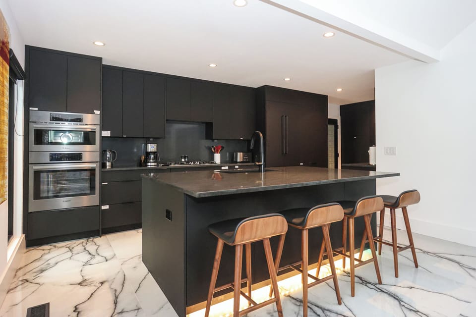 Kitchen area with island and seating.