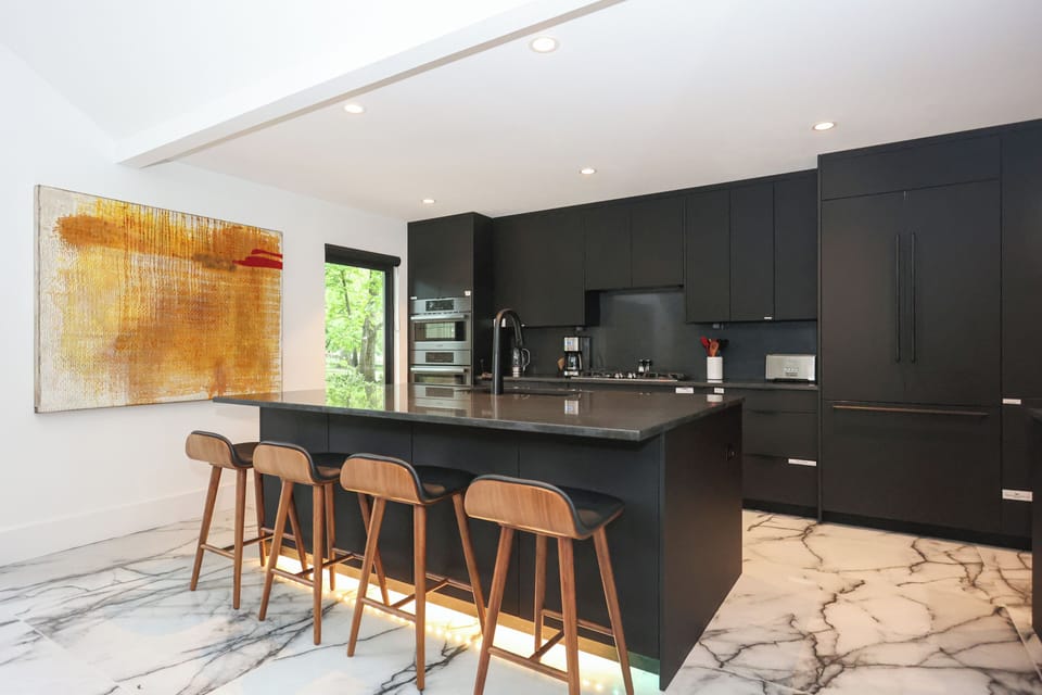 Kitchen area with island and seating.