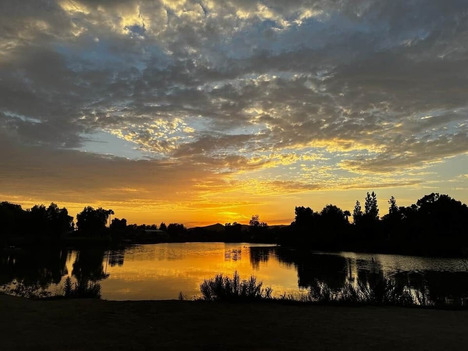 Sunset on the trail, Lindo Park.  End your day with breathtaking lakeside sunsets just steps from The Birdhouse SD — the perfect spot to unwind, reflect, and soak in the beauty of Southern California.