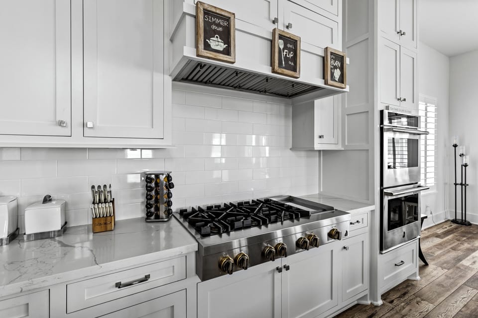 Modern kitchen with stovetop, dual ovens, and sleek design for effortless meals!