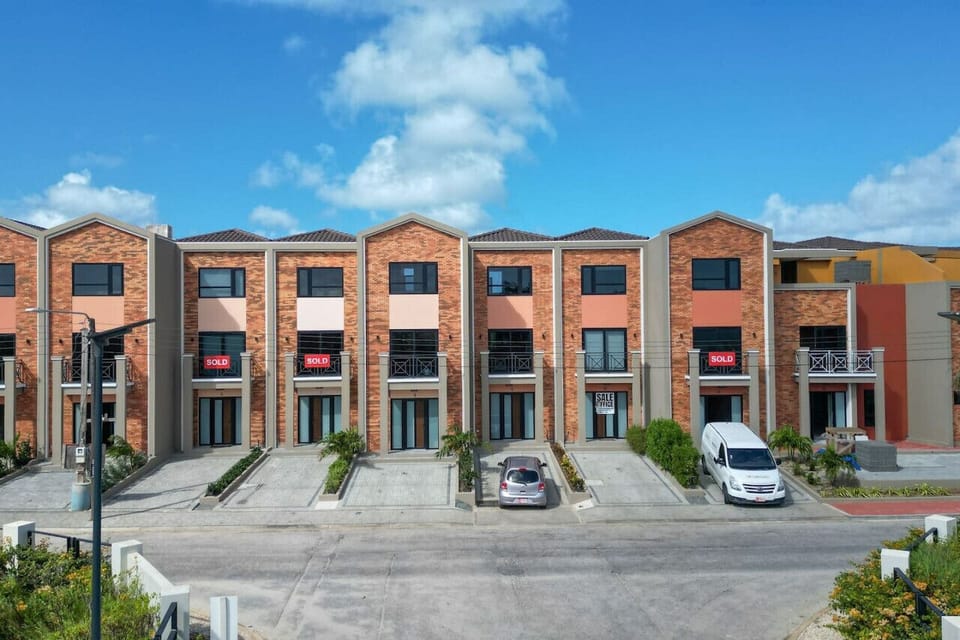 Experience the essence of community living at Porta Al Sole, where picturesque townhouses stand side by side, embodying a shared sense of belonging and camaraderi