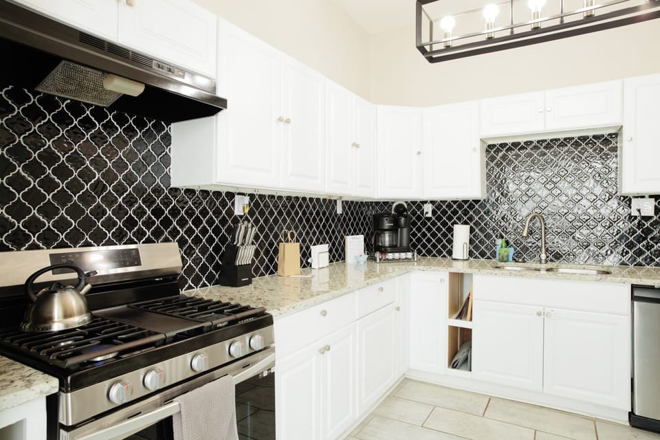 Plenty of kitchen to entertain. A chefs dream!! Fully stocked with a Keurig, mixer, toaster, colander, table linens, glassware, serving dishes and all cookware.