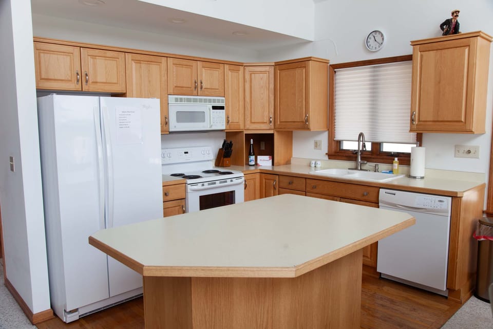 Kitchen- Fully stocked and ready for cooking—plenty of prep space.