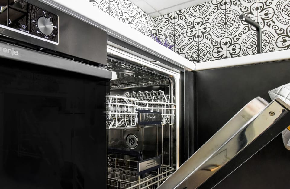 Convenience meets style with a state-of-the-art dishwasher in this modern kitchen. No need to worry about the dishes—just relax and enjoy your stay. Book now for a hassle-free vacation experience!