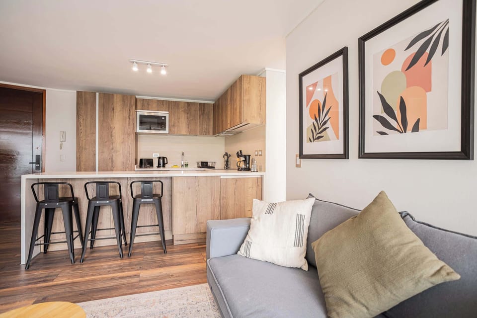 Chic and cozy kitchen with bar seating, perfect for enjoying a morning coffee or a quick meal in style.