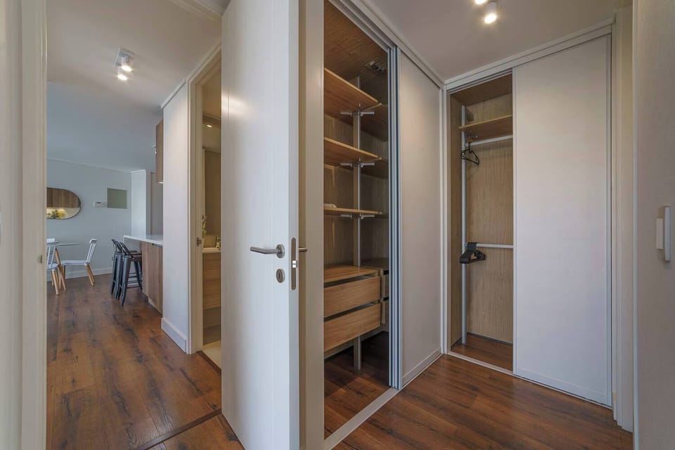 Spacious dining area with modern furnishings and ample storage, perfect for a cozy meal.