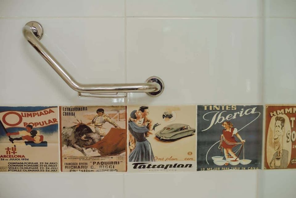 Step into a vintage-inspired bathroom with charming retro tiles and modern comforts.