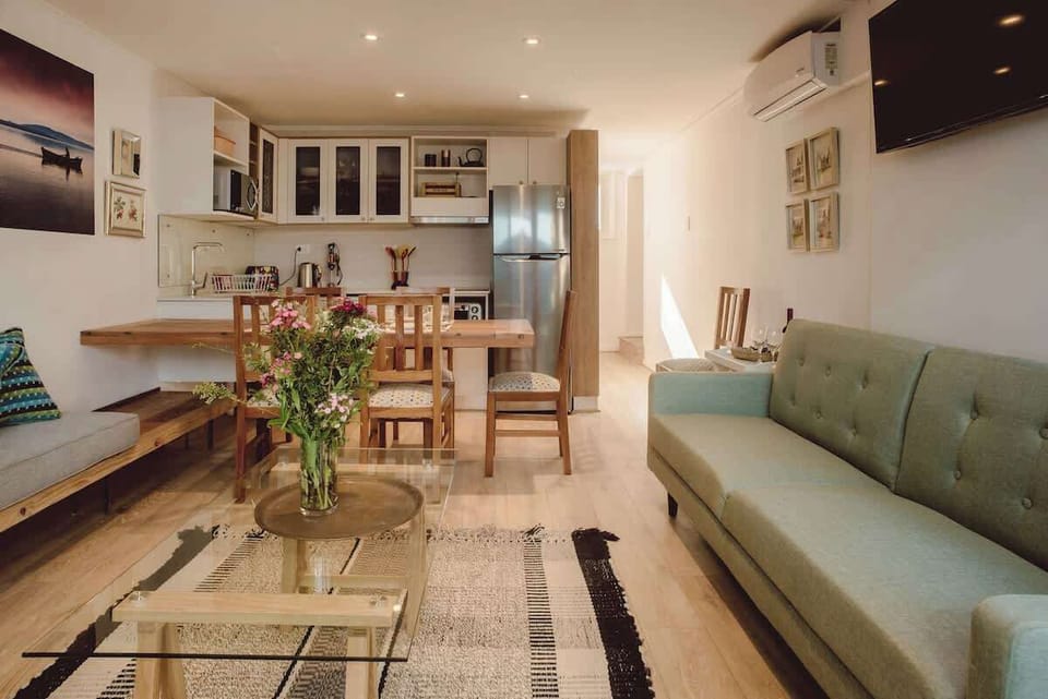 Charming open-plan living area with modern amenities and a cozy vibe, perfect for relaxing after a day of exploring.