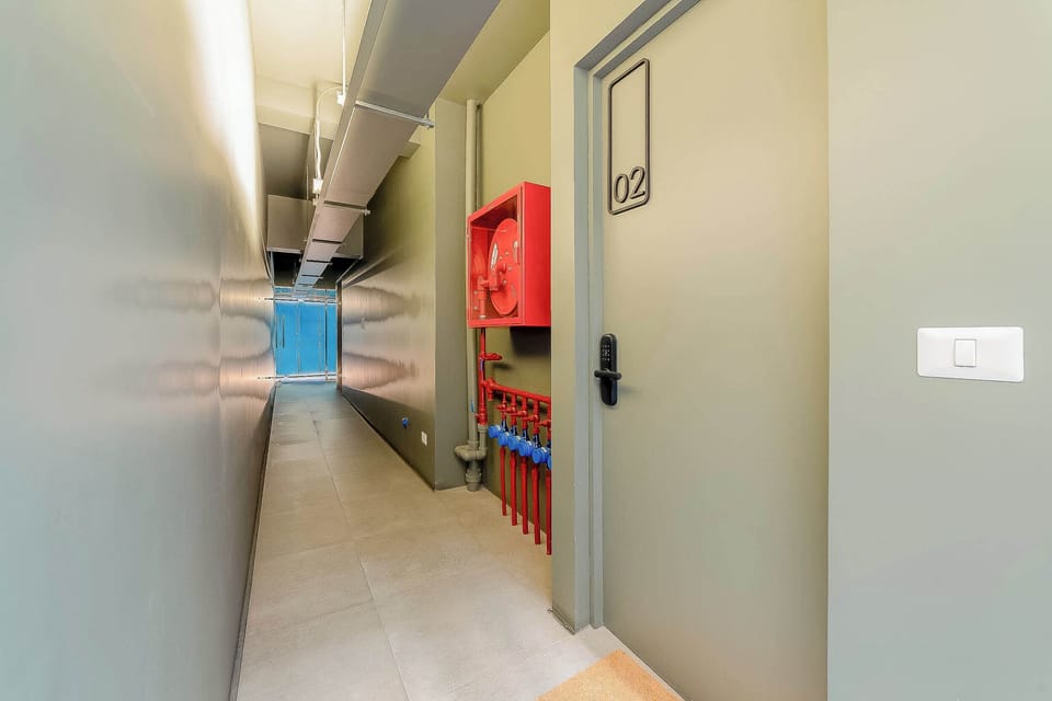 Secure and well-lit hallway leading to your cozy studio retreat.