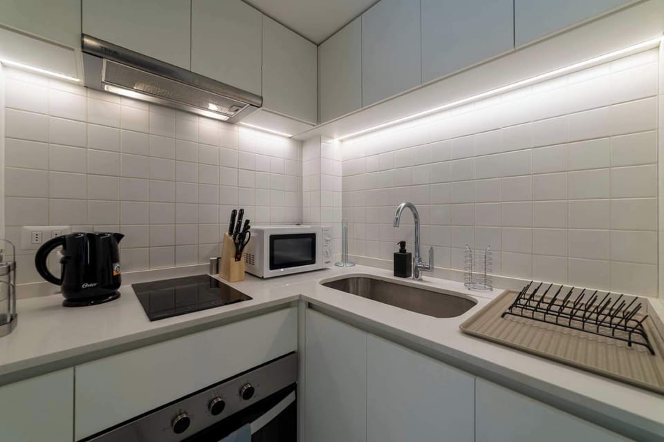 Modern and efficient kitchen with all essentials for a comfortable stay.