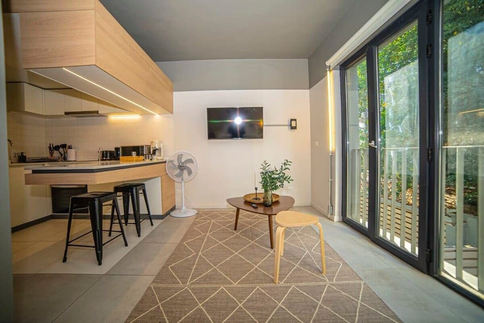 Stylish studio with modern kitchen and cozy living area, perfect for a relaxing stay.