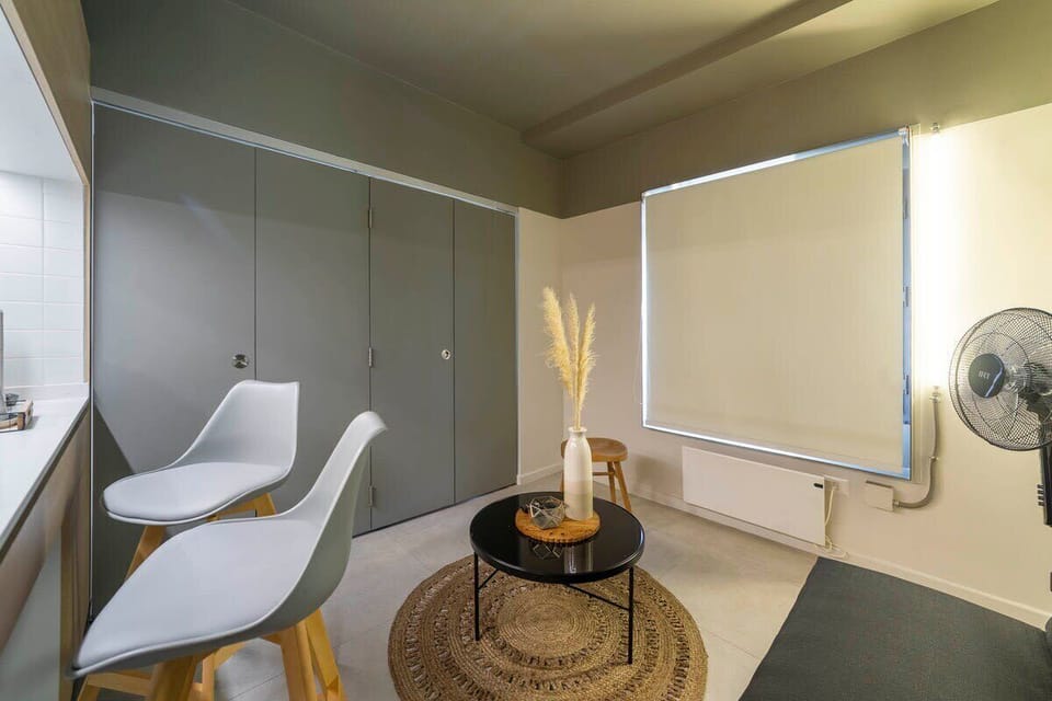 Cozy living area with modern seating and stylish decor, perfect for relaxing after exploring the city.