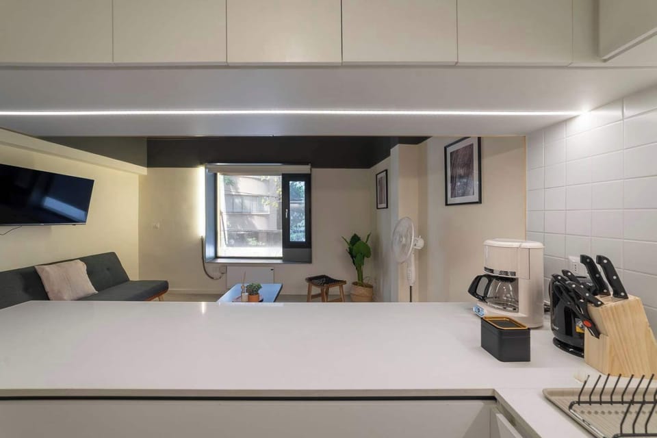 Experience modern comfort in this sleek studio with a cozy living area and well-equipped kitchen, perfect for relaxing after exploring the city.