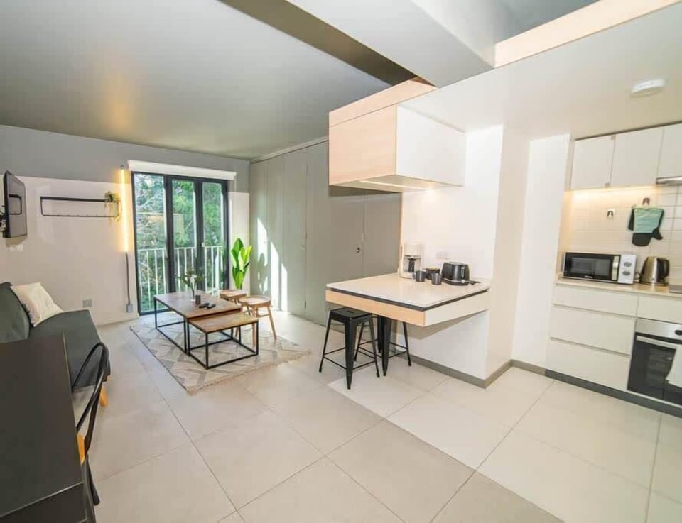 Bright and modern studio with open-plan living and kitchen area, perfect for a cozy stay.