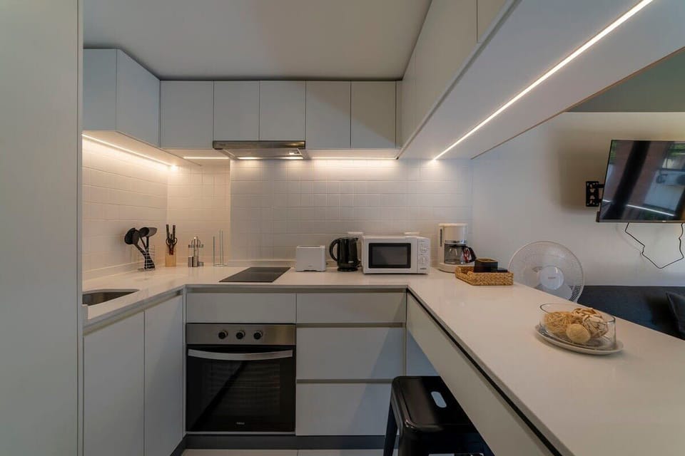 Sleek and modern kitchen equipped with all essentials for a comfortable stay.
