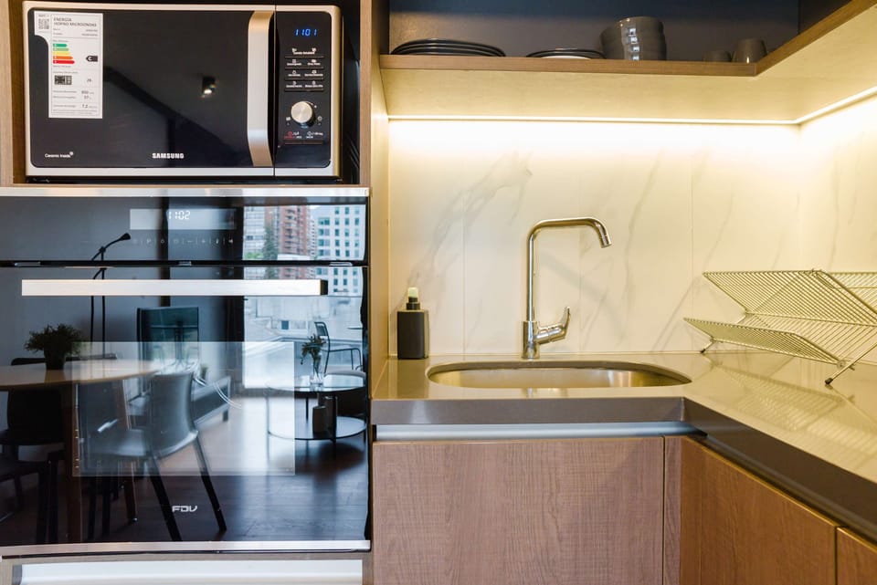 Sleek and modern kitchen with top appliances, perfect for cooking up a storm during your stay.