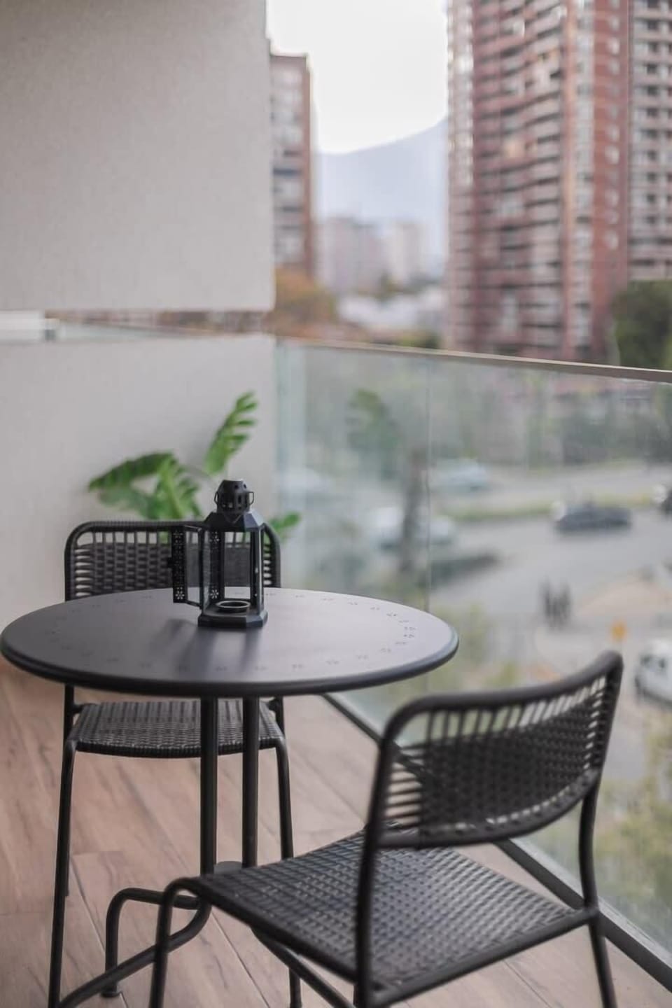 Enjoy your morning coffee with stunning city views from this cozy private balcony in the heart of Santiago.